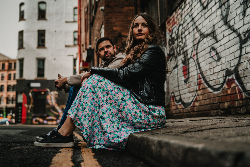 Engagement shoot with couples in cool outfits.
