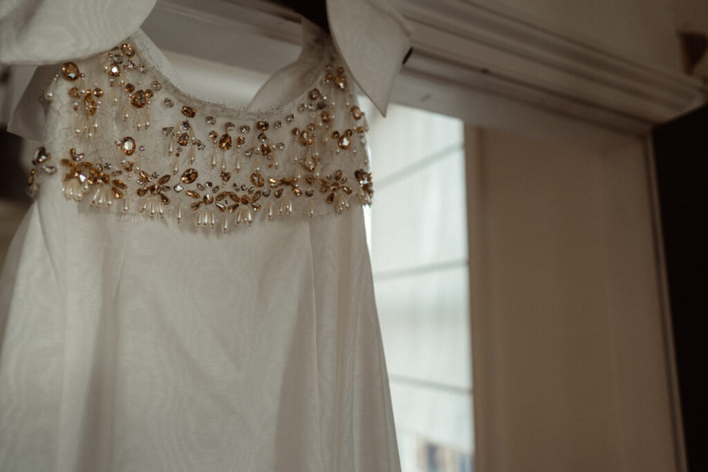 Bride's dress hanging up.