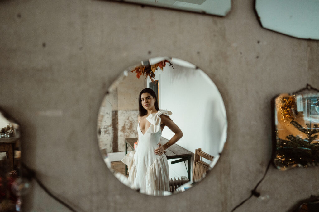 Bride standing in front of a mirror.
