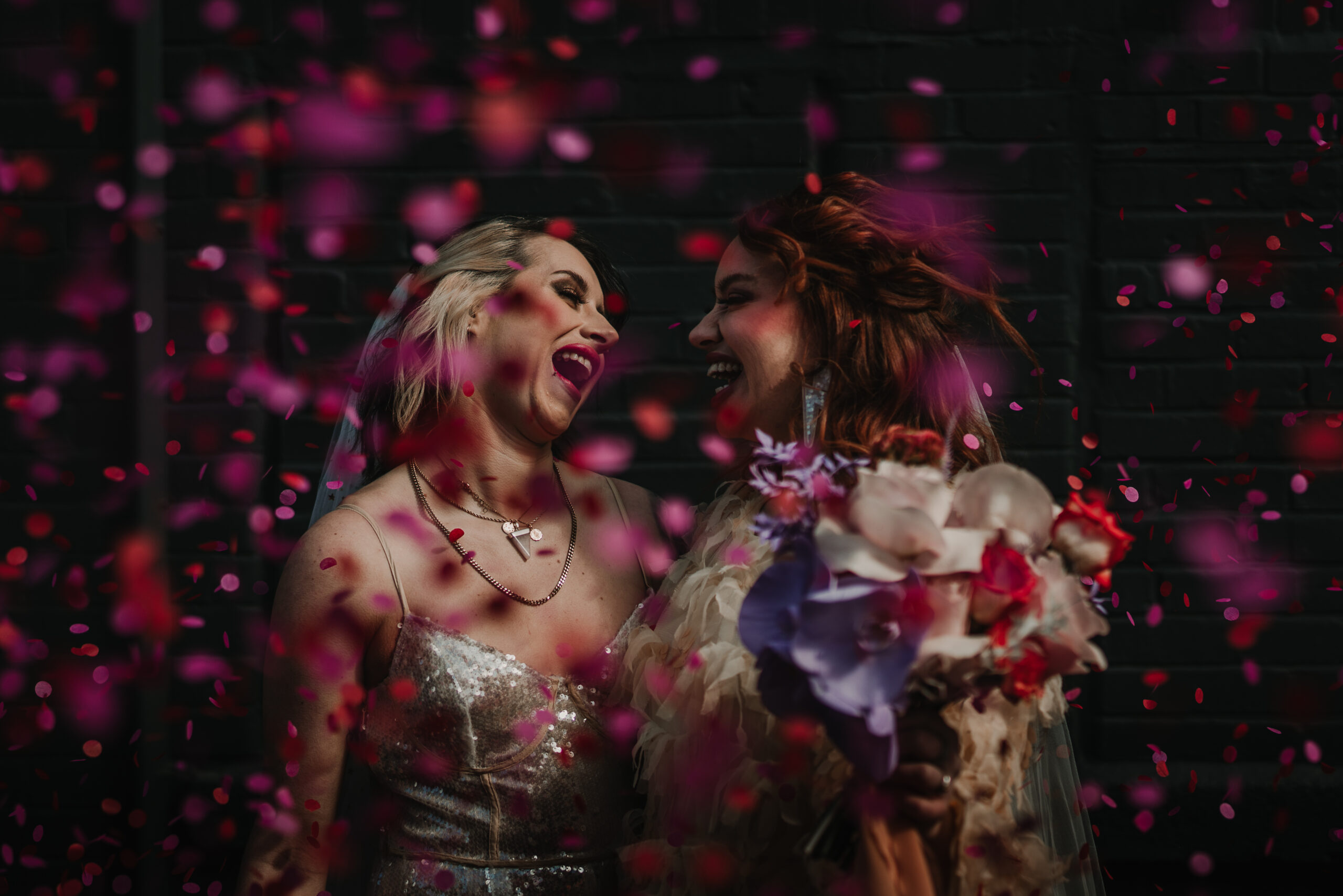 Married couple surrounded by confetti